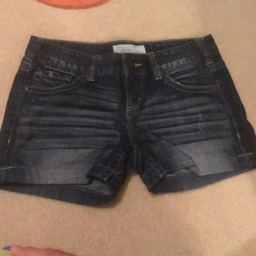 Dark blue jean shorts.